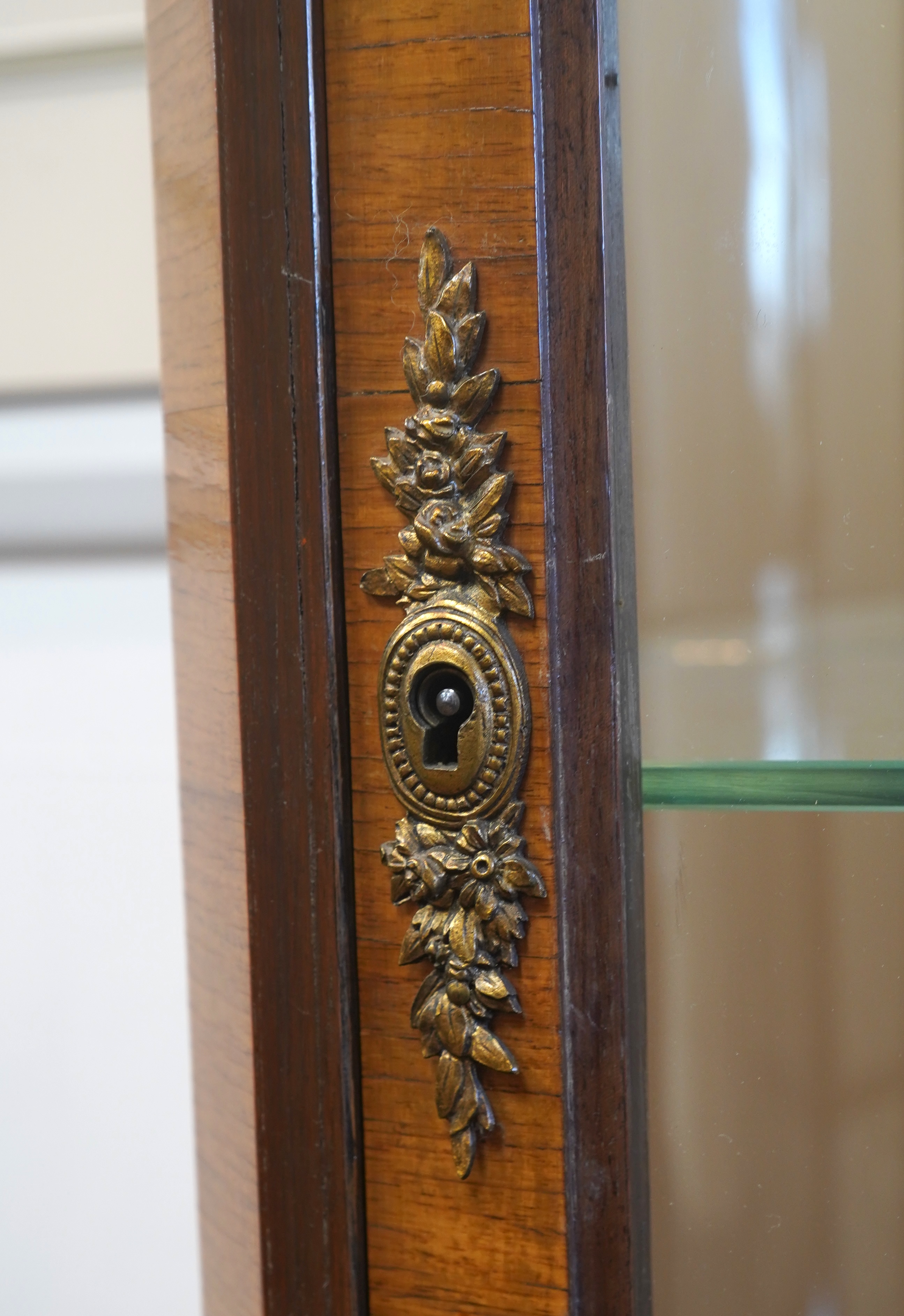 A Louis XVI style marquetry inlaid, gilt metal mounted kingwood vitrine